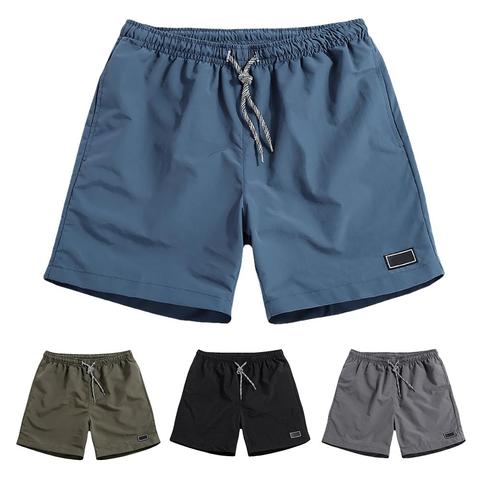 Men Casual Breathable Quick Dry Pants Pockets Beach Solid Color Sport Shorts ► Photo 1/6