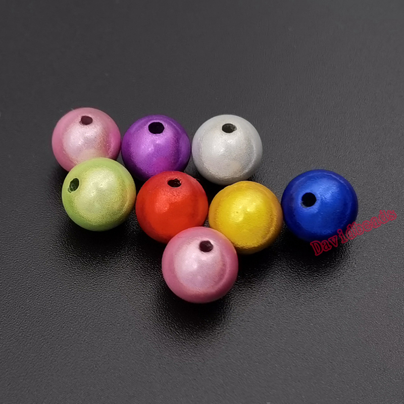 100 perles en acrylique stardust multicolore. Diam 8 mm.