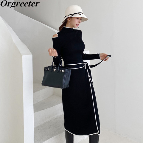 High-quality Shoulder Hollow Long Sleeve Black Knitted Dress White Striped Trim Sashes Bow Slim Split Mid-length Sweater Dress ► Photo 1/6