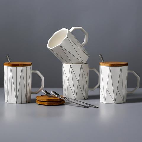 https://alitools.io/en/showcase/image?url=https%3A%2F%2Fae01.alicdn.com%2Fkf%2FHTB1SNdUMCzqK1RjSZPxq6A4tVXa6%2FCreative-matte-geometric-mug-with-bamboo-lid-metal-spoon-line-ceramic-cup-mugs-microwave-milk-cup.jpg_480x480.jpg