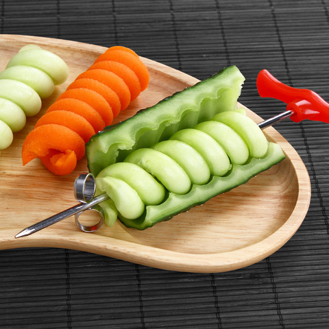https://alitools.io/en/showcase/image?url=https%3A%2F%2Fae01.alicdn.com%2Fkf%2FHTB1UPU1SZbpK1RjSZFyq6x_qFXak%2FVegetables-Spiral-Knife-Carving-Tool-Potato-Carrot-Cucumber-Salad-Chopper-Manual-Spiral-Screw-Slicer-Cutter-Spiralizer.jpg_480x480.jpg