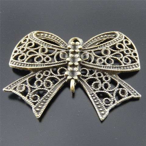 Julie Wang 2PCS Bowknot Charms Alloy Antique Bronze Hollow Bow Skeleton Pendant Necklace Jewelry Making Handmade Hanging Tops ► Photo 1/5
