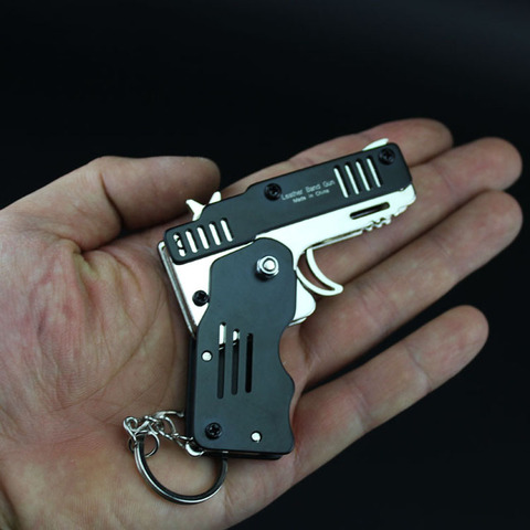 All metal mini can be folded as a key ring rubber band gun children's gift toy six bursts of rubber toy pistol  toy gun ► Photo 1/5