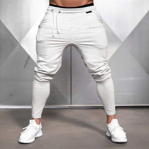 Pantalones de chándal sólidos para gimnasio para hombre, pantalón informal, para Fitness, entrenamiento, chándal de algodón, ropa deportiva para primavera y otoño ► Foto 1/6