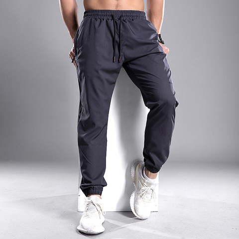 Pantalones para correr de hombres, ropa deportiva de entrenamiento de gimnasia, con bolsillos y cremallera ► Foto 1/6