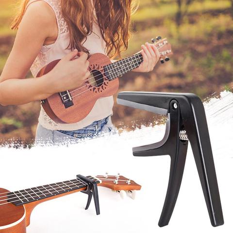 IRIN profesional cejilla de Ukelele solo cambio rápido Ukelele Capo 4 cuerdas Hawaii Capos de guitarra piezas y accesorios ► Foto 1/6