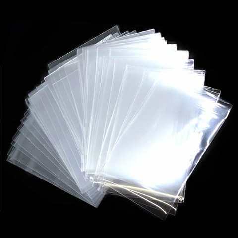 100 unids/lote * 65*90mm transparente Tarjeta de tarjetas Protector de la magia de los asesinos de tres unido Estrella del Fútbol tarjeta para juegos de mesa ► Foto 1/5