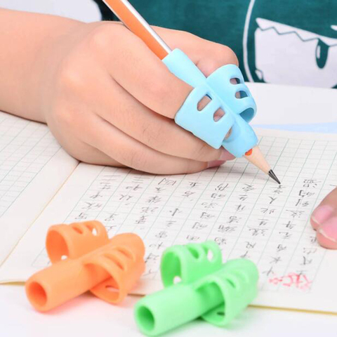 1pc dos pluma en forma de dedo titular niños lápiz para escribir soporte Pan práctica de silicona de agarre para ayudar a los estudiantes a dedo dispositivo de posicionamiento ► Foto 1/6