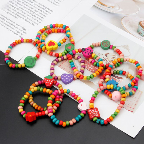 12 unids/set pulseras de madera coloridas pequeños brazaletes para chicas Kit de joyería de moda para niños para Amigos de la familia regalos de joyería ► Foto 1/6