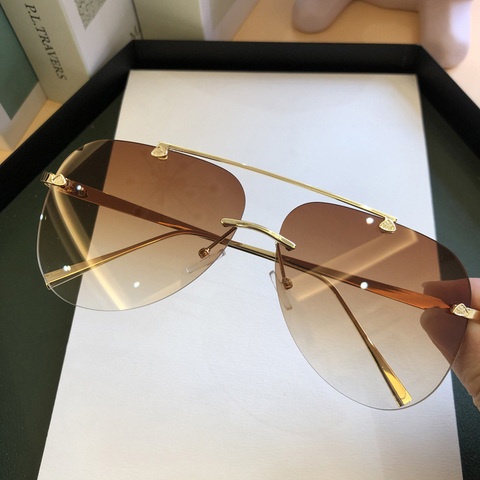 FEISHINI-gafas de sol de Metal sin montura para hombre y mujer, lentes de sol masculinas de estilo piloto a la moda, con gradiente Protector UV, 2022 ► Foto 1/6