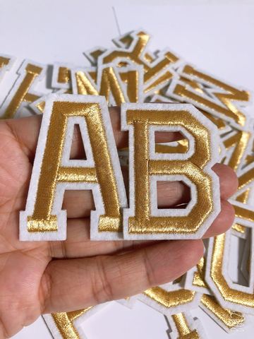 Parche dorado claro con letras del alfabeto, apliques bordados, letras planchadas ► Foto 1/3