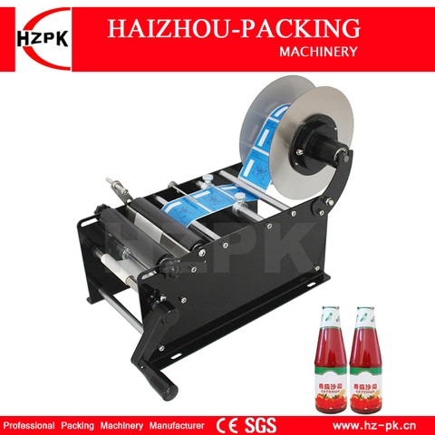 HZPK Mini Manual adhesivo mango pequeño tarro plástico máquina de etiquetado de botellas redondas etiquetas de papel Semi-automática máquina de embalaje ► Foto 1/6