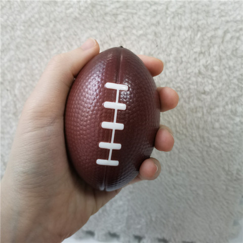 Pelota de juguete de Rugby americano para niños, juguete de espuma de esponja para apretar a mano, alivio del estrés, juguetes deportivos para el aire libre, 9CM ► Foto 1/6