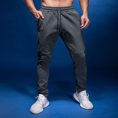 Pantalones de chándal para hombre, pantalón de entrenamiento con bolsillo y cremallera, ropa deportiva, leggings de Fitness para gimnasio ► Foto 1/6