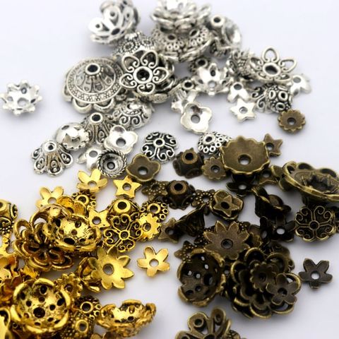 150 pièces mixte tibétain argent or fleur métal entretoise fin lâche perle casquettes pour la fabrication de bijoux trouver en gros ► Photo 1/6