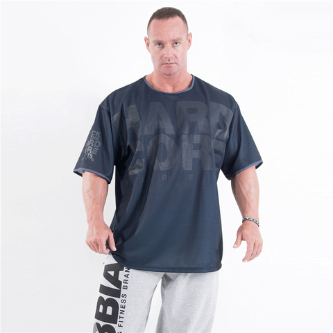 T-shirt de Sport à manches courtes pour hommes, ample et respirant, en maille, décontracté, pour entraînement, course à pied, Fitness ► Photo 1/1