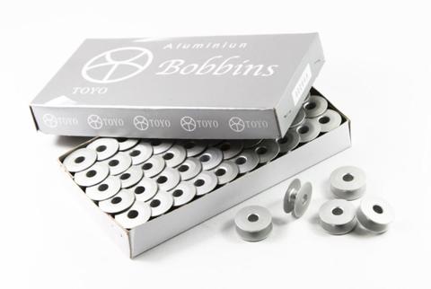 Bobine en ALUMINIUM 272152 pour MACHINE à broder TAJIMA ► Photo 1/4