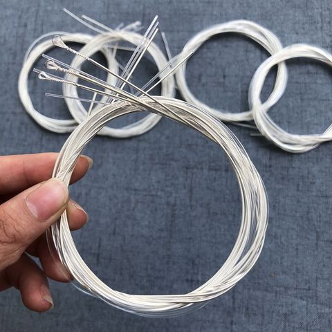 6 pièces/ensemble cordes de guitare cordes en Nylon argent pour guitare acoustique classique cordes de guitare de haute qualité 1-6 E B G D A E ► Photo 1/6